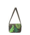 Green handbag with leaf patterns on a white background