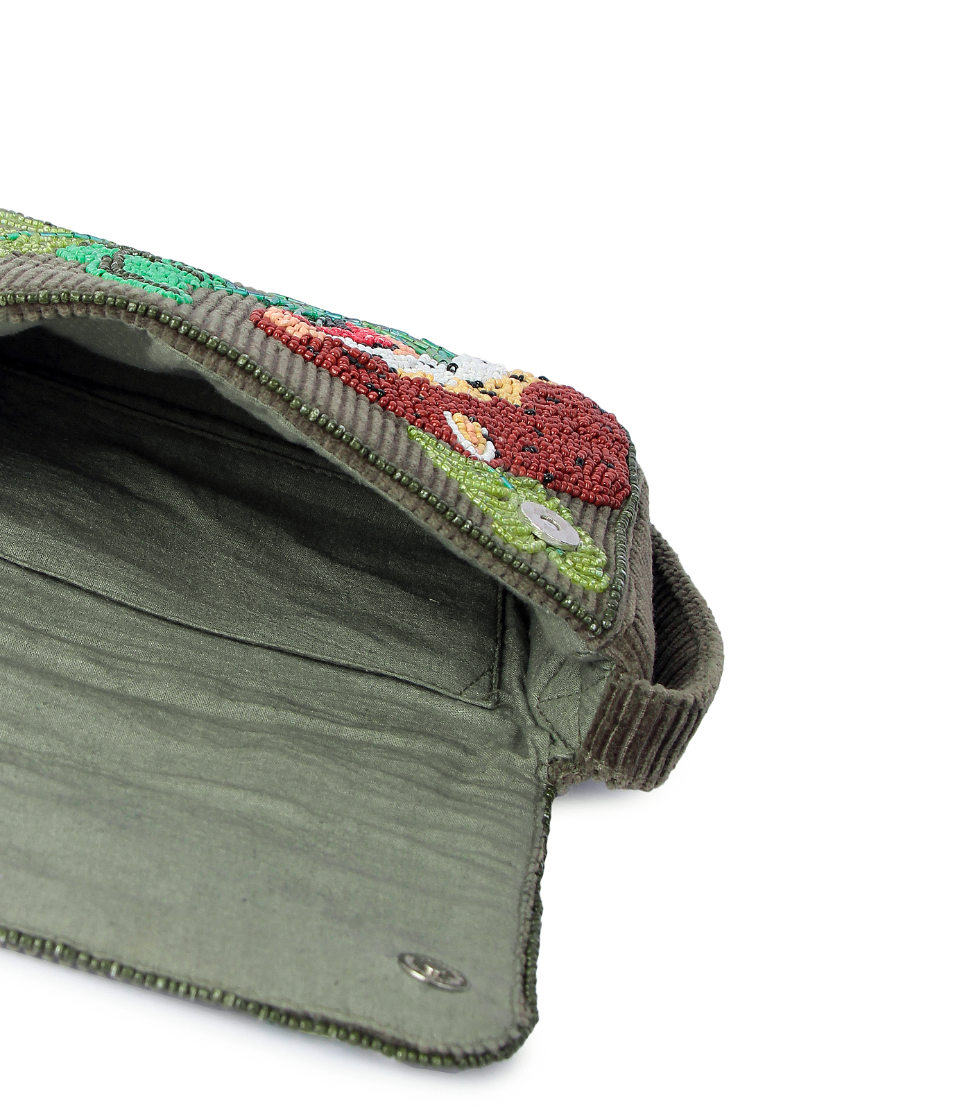 Green fabric with embroidered floral pattern on a white background