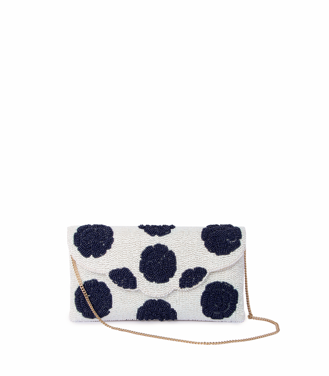 White clutch bag with black polka dots and a gold chain on a white background