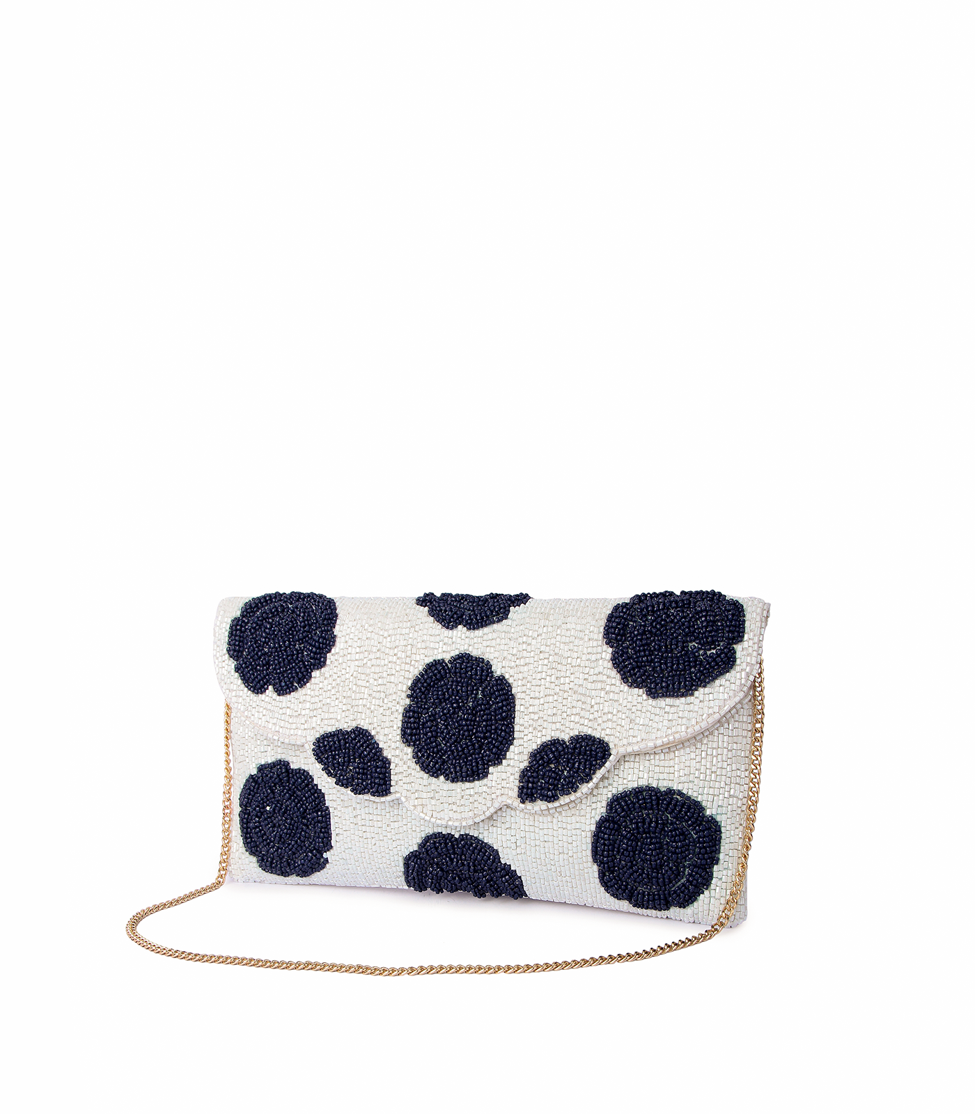 White clutch bag with black polka dots on a white background