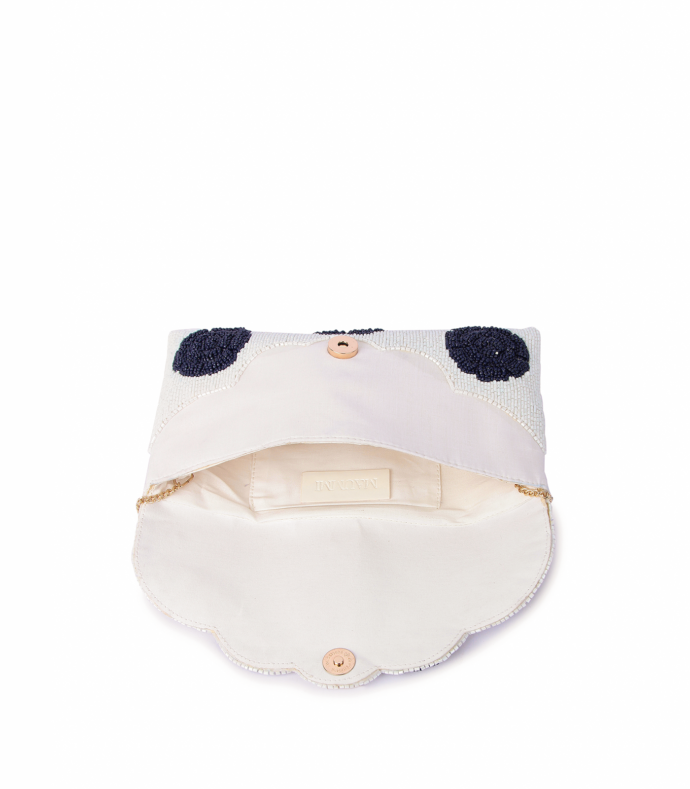 White visor with black polka dots and gold accents on a white background