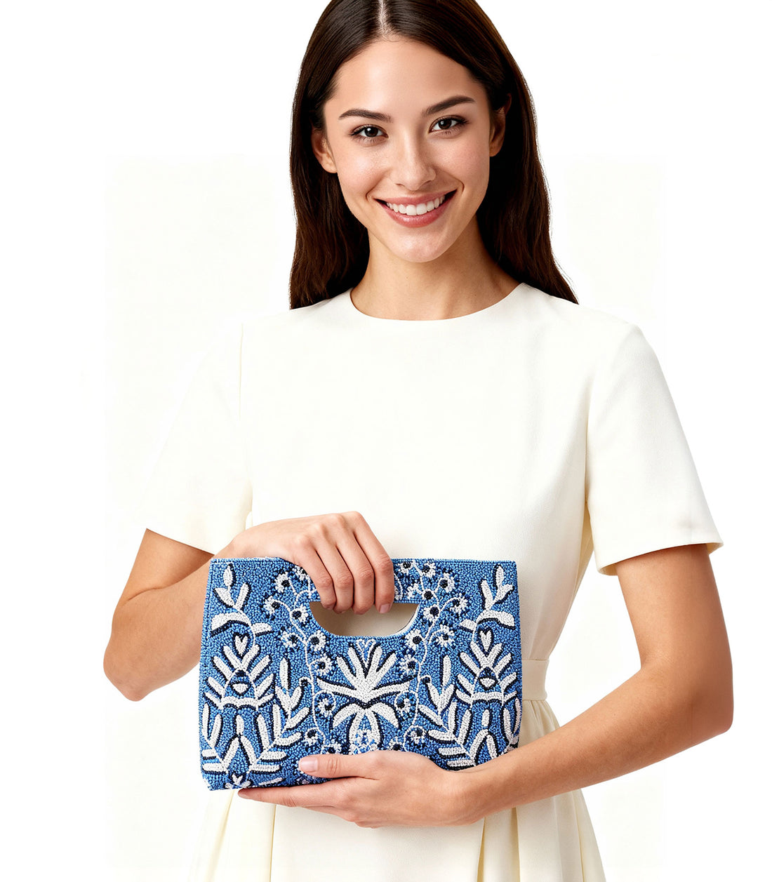 Blue clutch bag with white floral patterns on a white background
