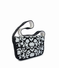 Black handbag with white floral pattern on a white background