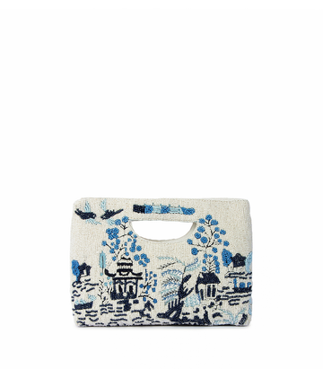 Handbag with blue floral and architectural design on a white background