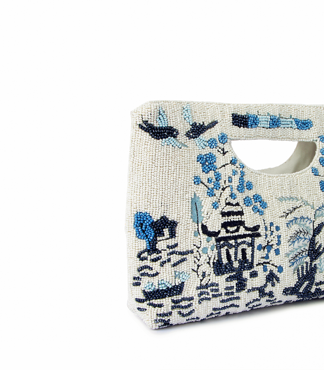 Handbag with blue floral and architectural design on a white background