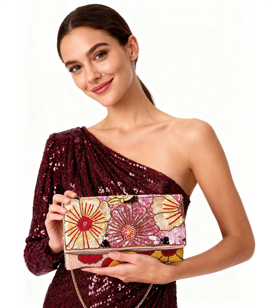 Colorful floral-patterned handbag on a white background